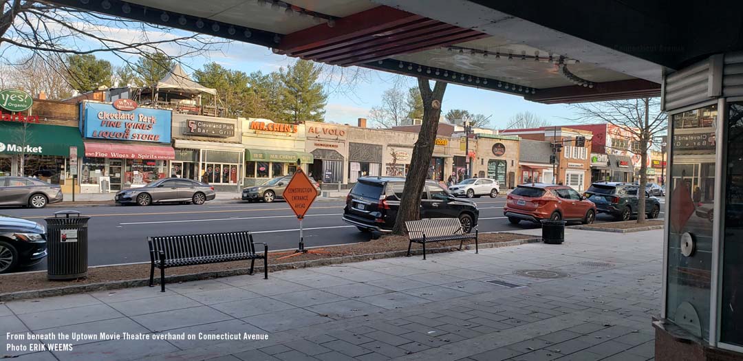 Beneath the Uptown Movie Theater overhang looking out at Connecticut Avenue in Cleveland Park area