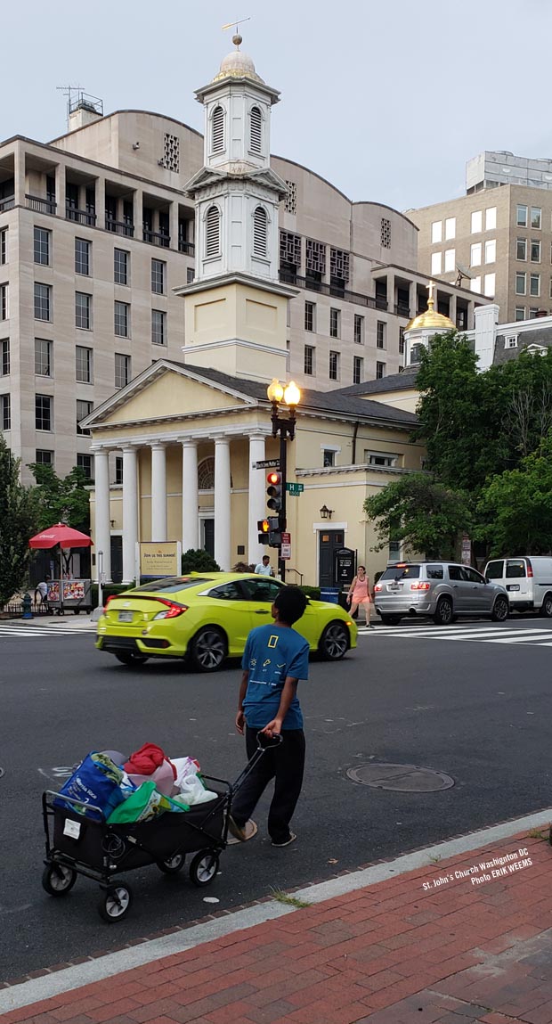 Pulling a wagon along H Street by St John's Church